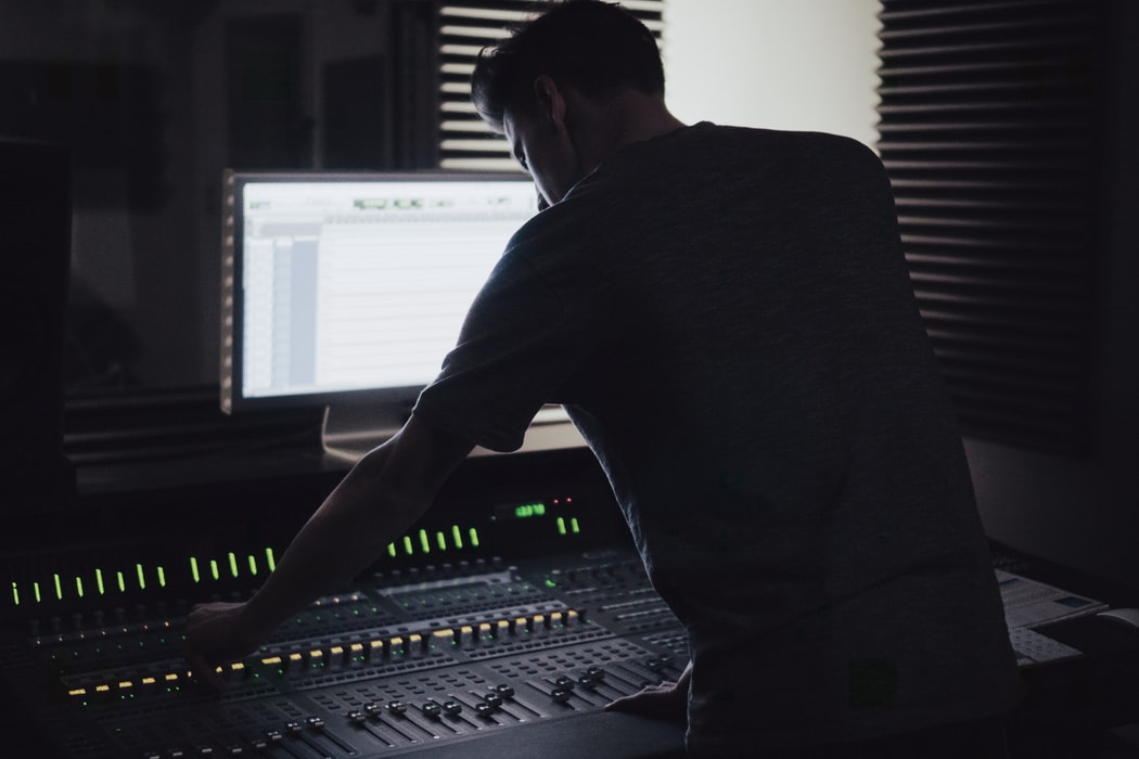 Man using radio soundboard